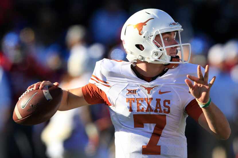 FILE - In this Nov. 19, 2016, file photo, Texas quarterback Shane Buechele passes to a...