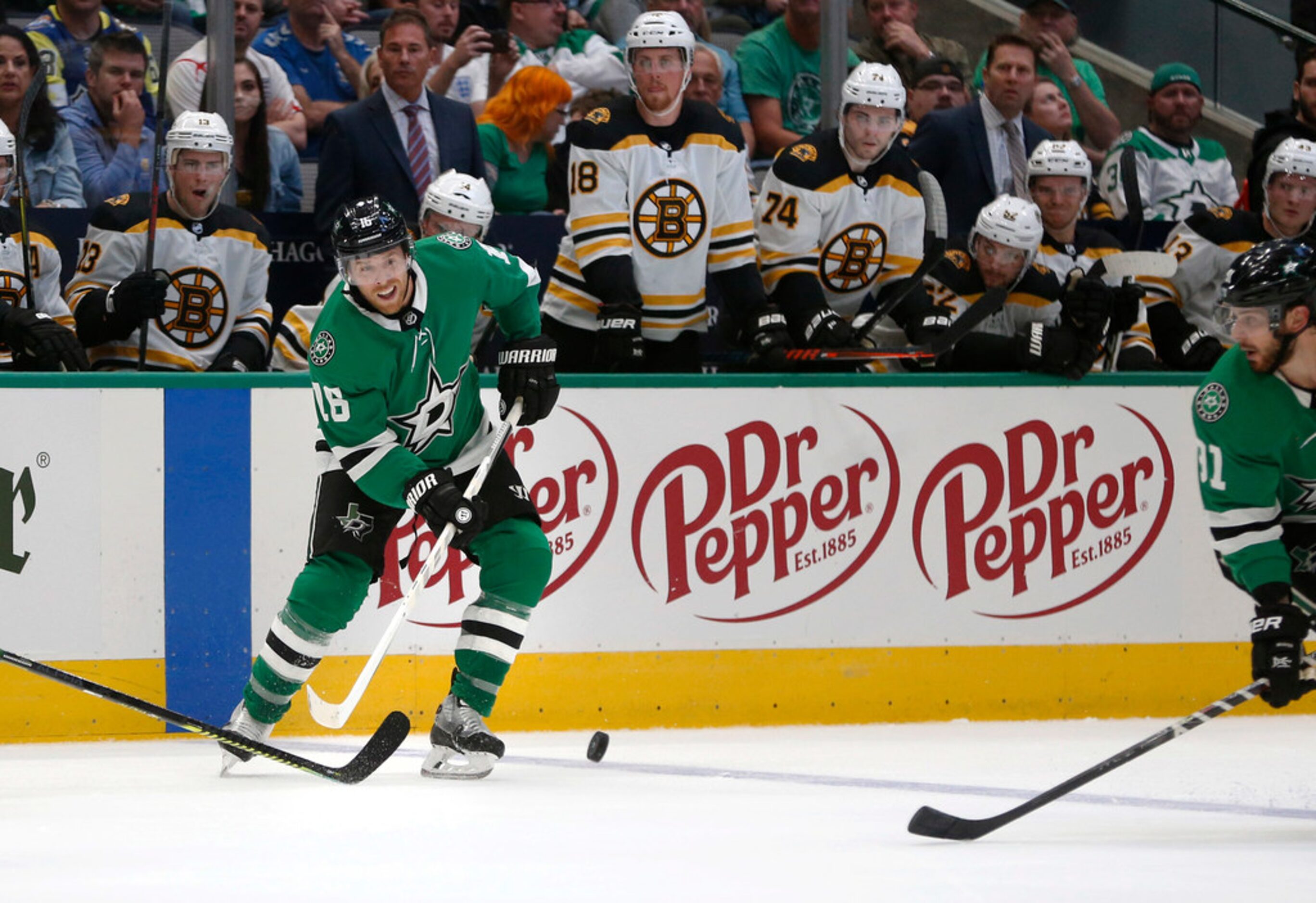 Dallas Stars center Joe Pavelski (16) passes the puck in a game against the Boston Bruins...