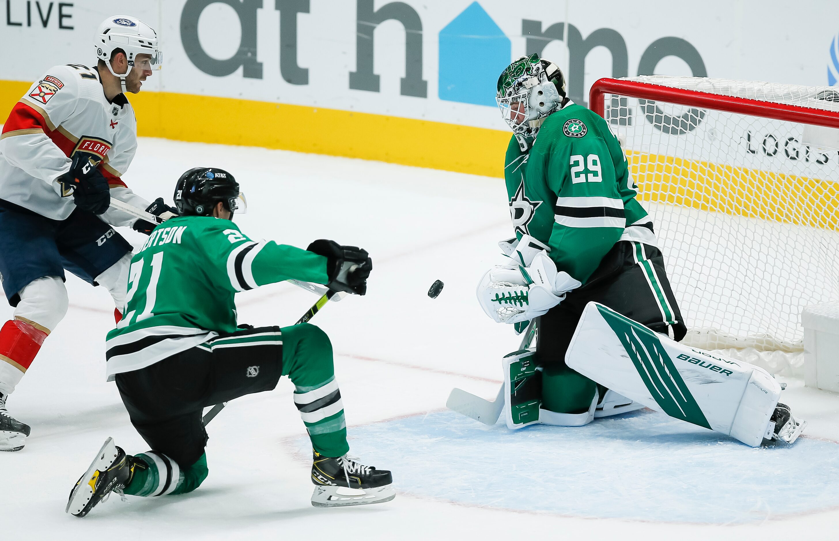 Dallas Stars forward Jason Robertson (21) looks on as goaltender Jake Oettinger (29) stops a...