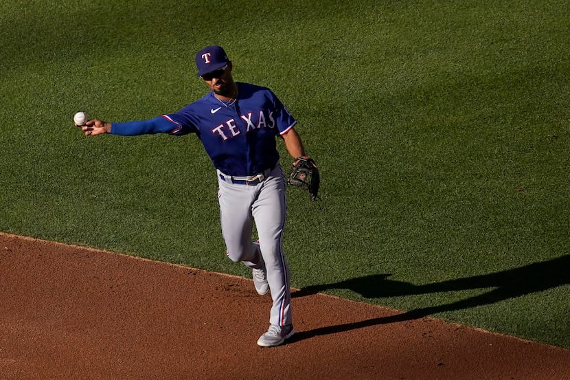 Texas Rangers second baseman Marcus Semien throws out Oakland Athletics' Sean Murphy at...