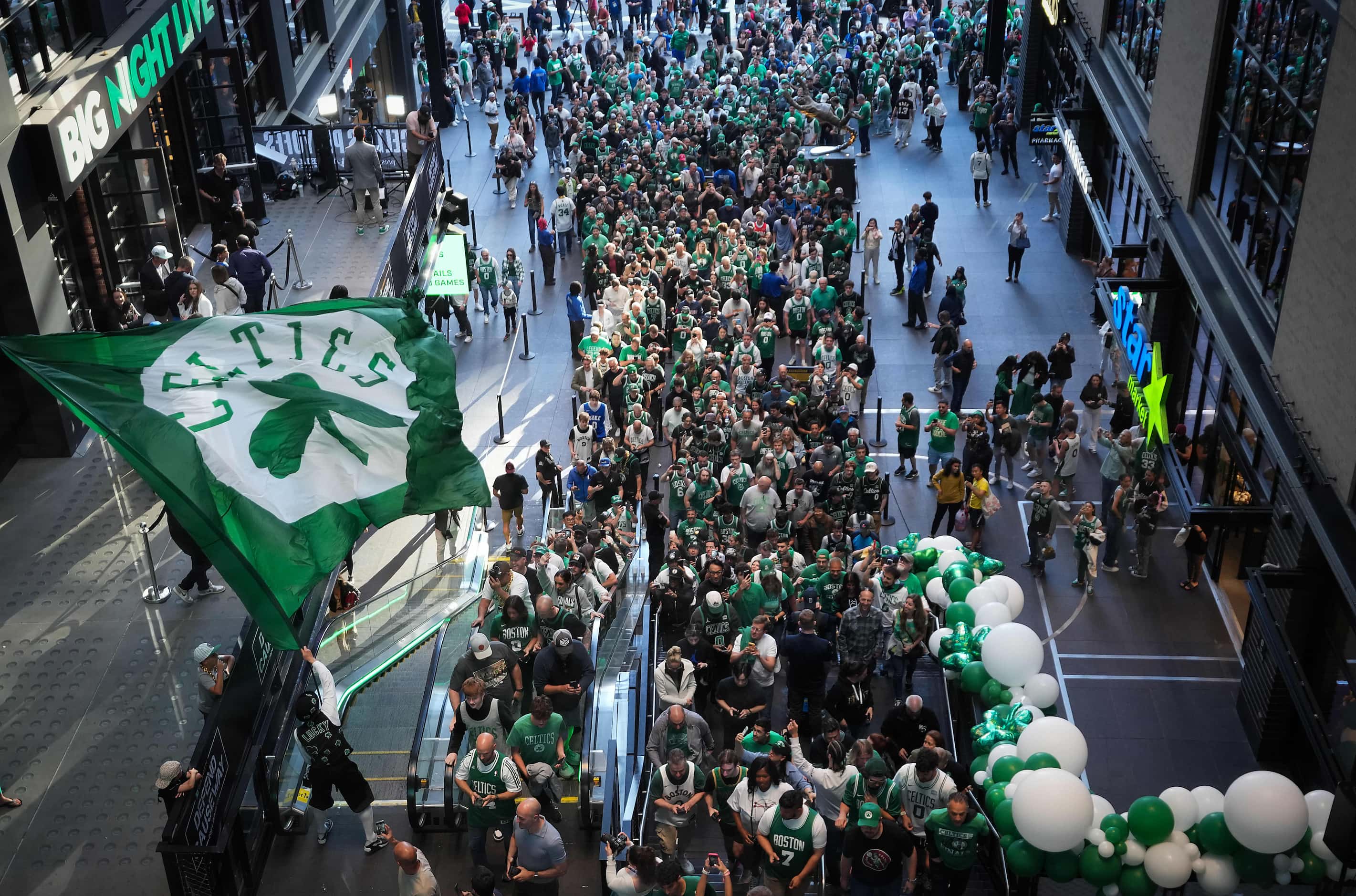 Boston Celtics mascot Lucky waves a flag as fans head for the arena as the gates open at TD...