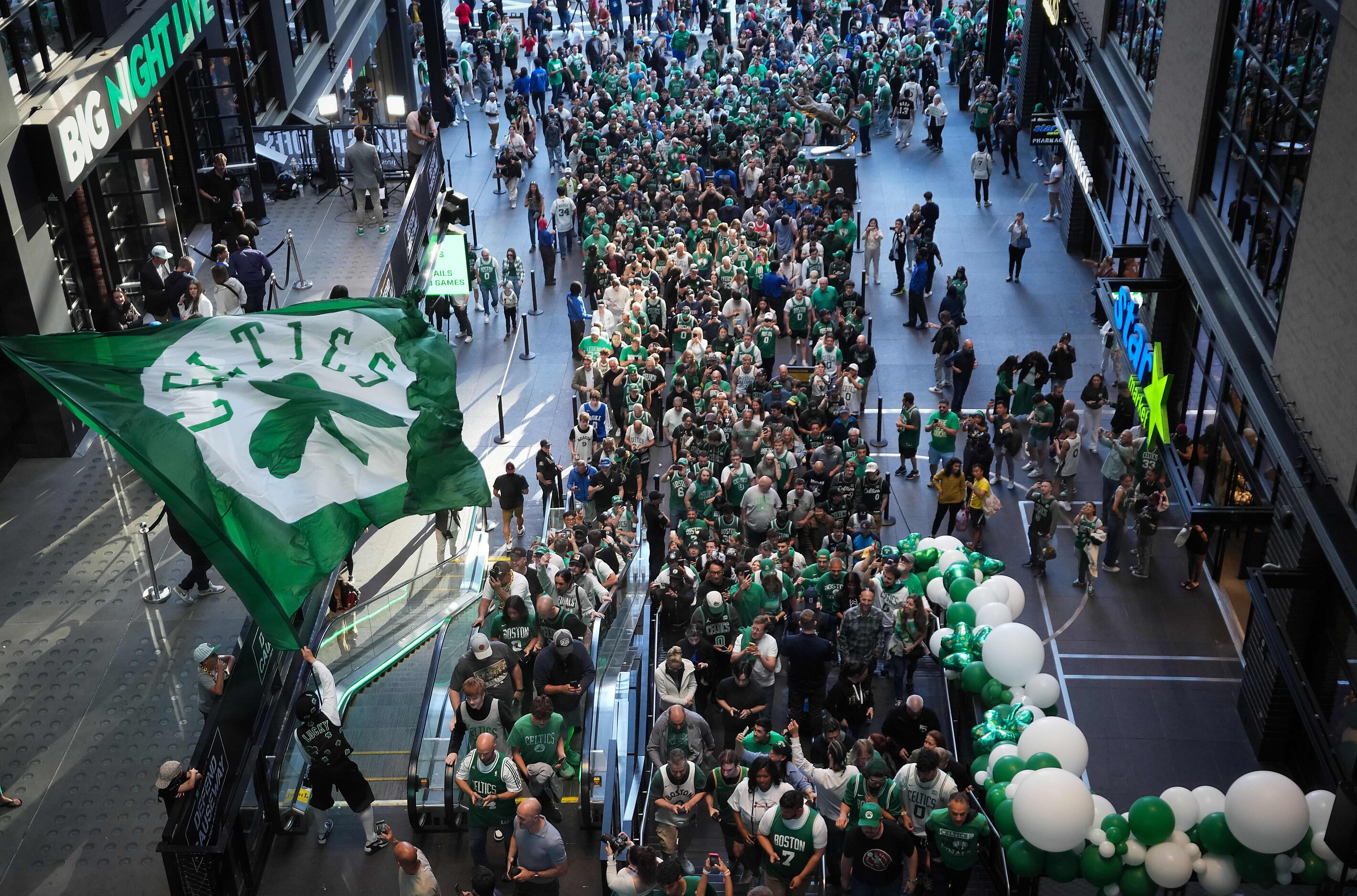 Boston Celtics mascot Lucky waves a flag as fans head for the arena as the gates open at TD...