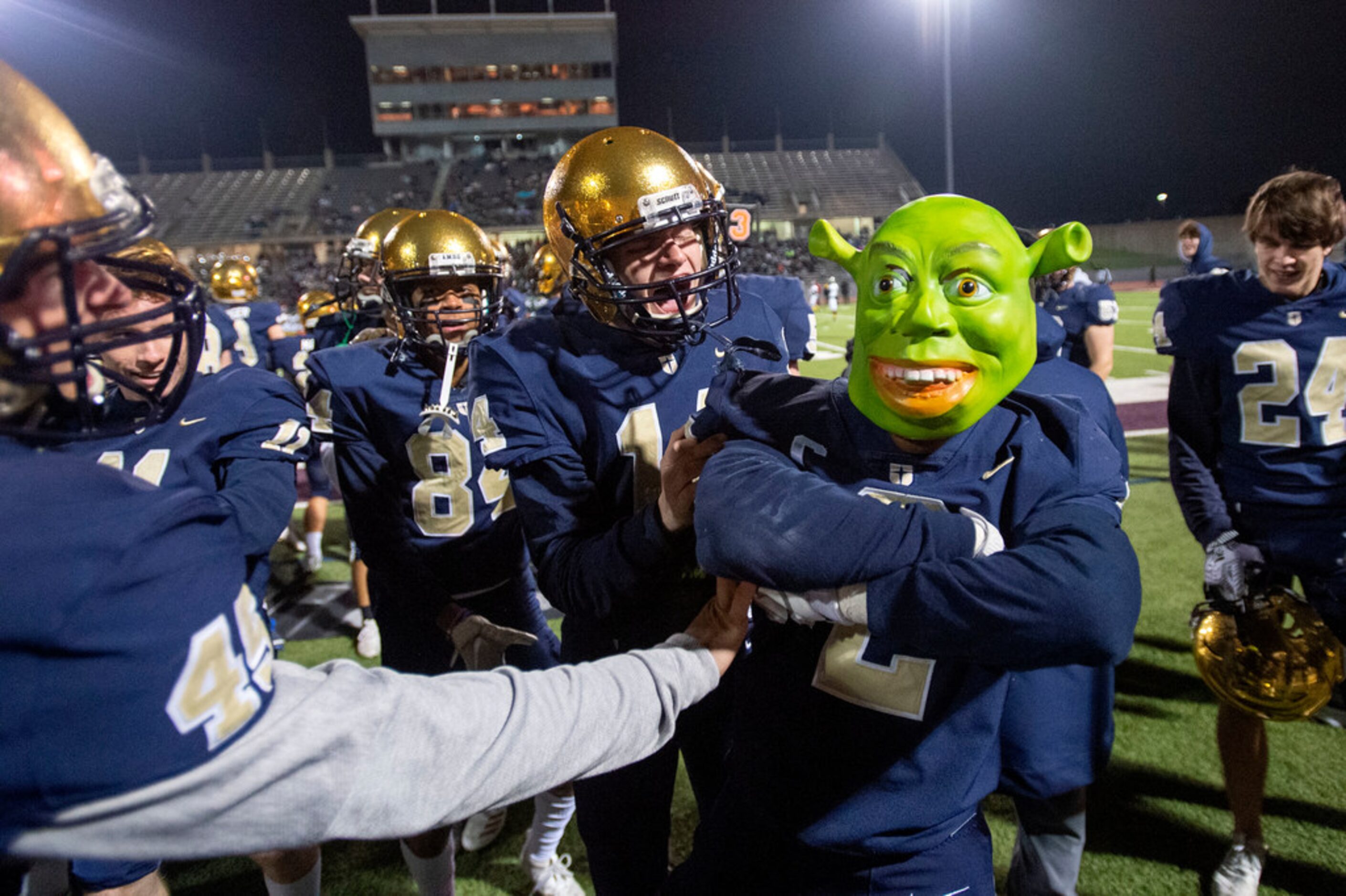 Jesuit senior defensive back Jhalen Spicer (2) celebrates with teammates while wearing a...