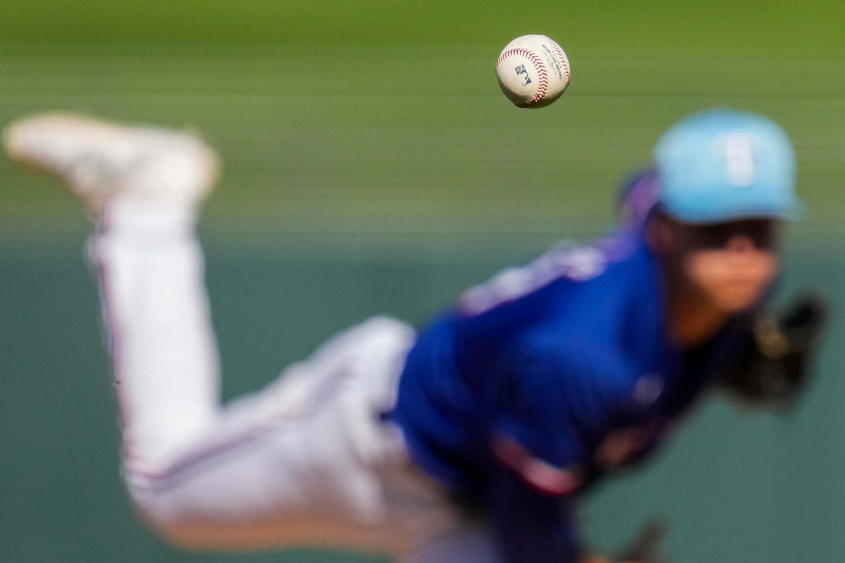 Texas Rangers pitcher Jack Leiter delivers during the sixth inning of a spring training game...
