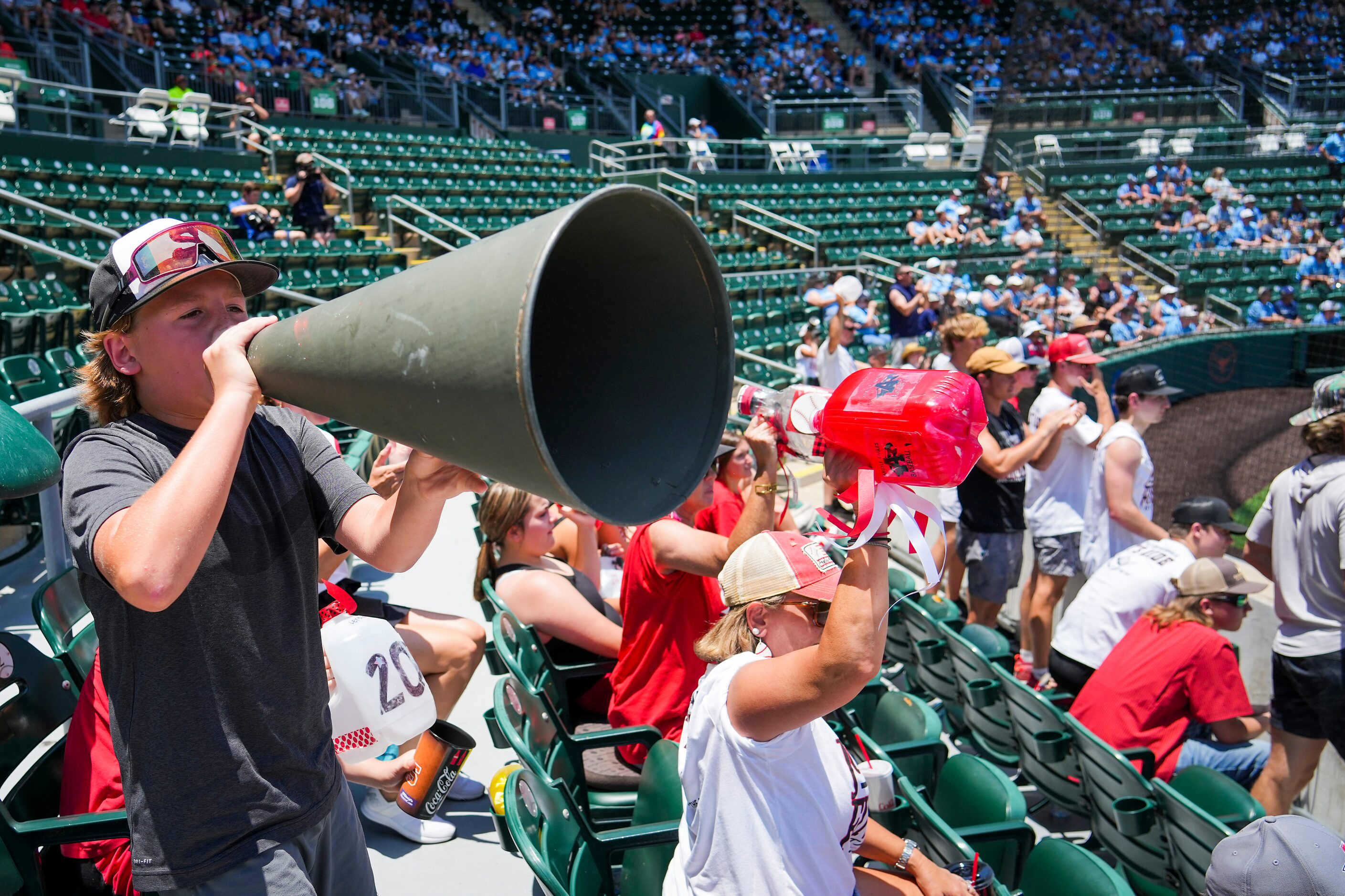 Argyle fans cheer as their team bats during the first inning of a UIL 4A baseball state...