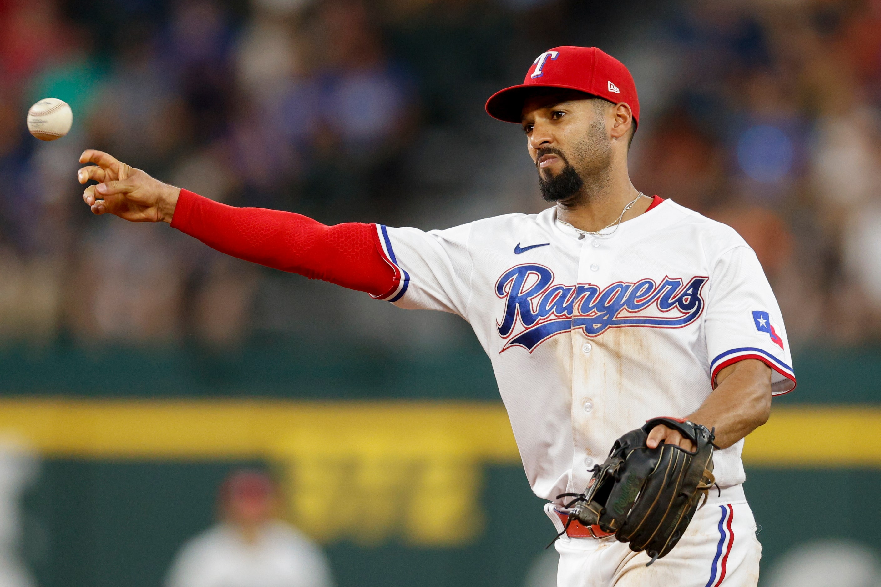 Texas Rangers second baseman Marcus Semien (2) throws to first base for an out during the...