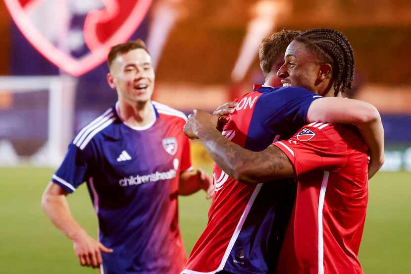 FC Dallas forward Dante Sealy (right) celebrates with this teammates after scoring a goal in...