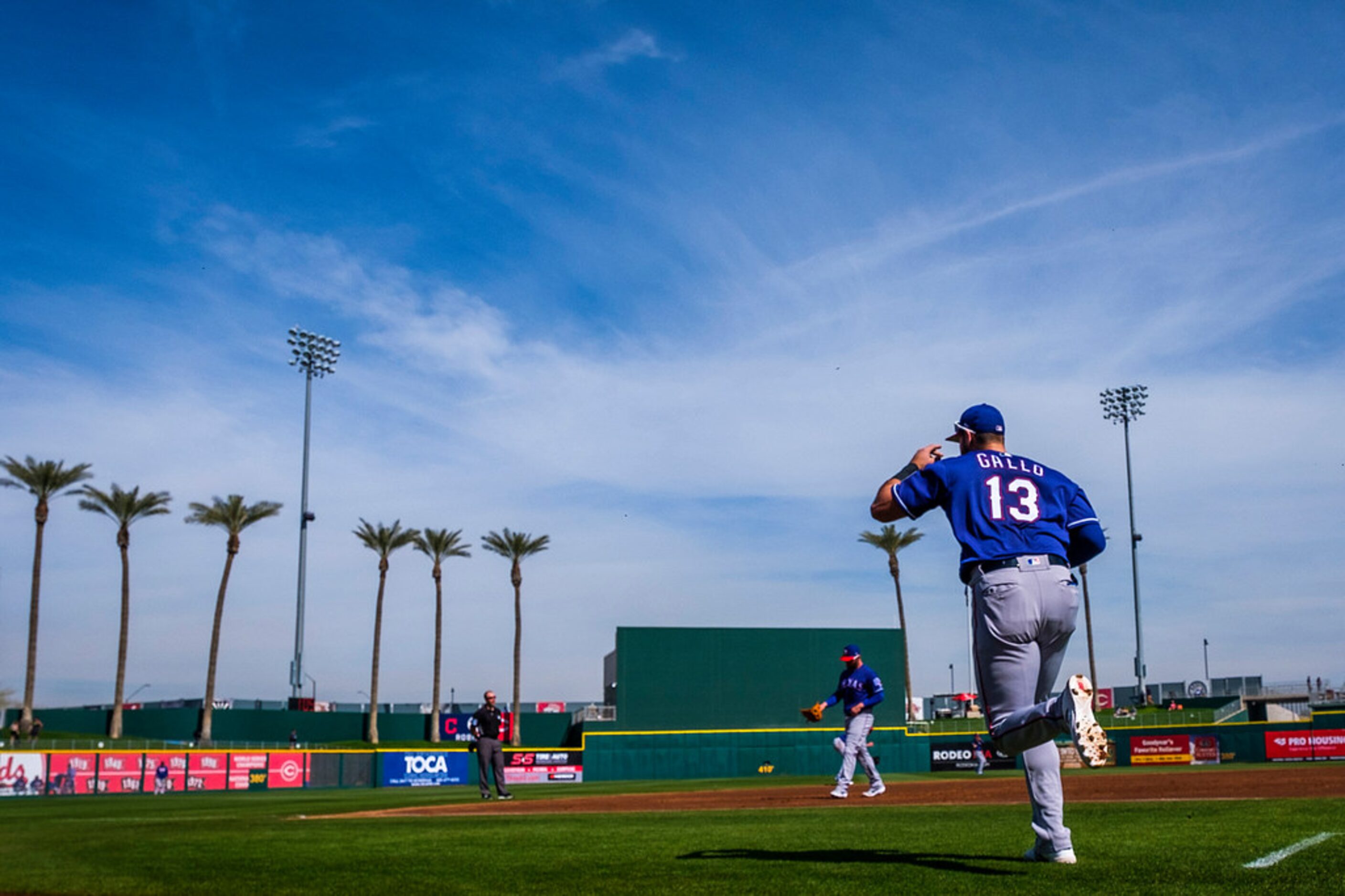 Texas Rangers outfielder Joey Gallo head for the outfield during the fifth inning of a...