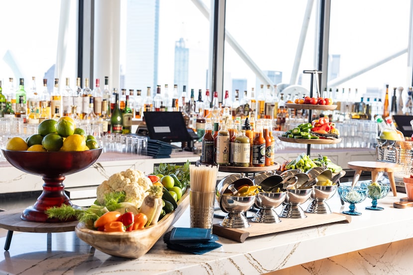 A brunch buffet is set up on a large bar.