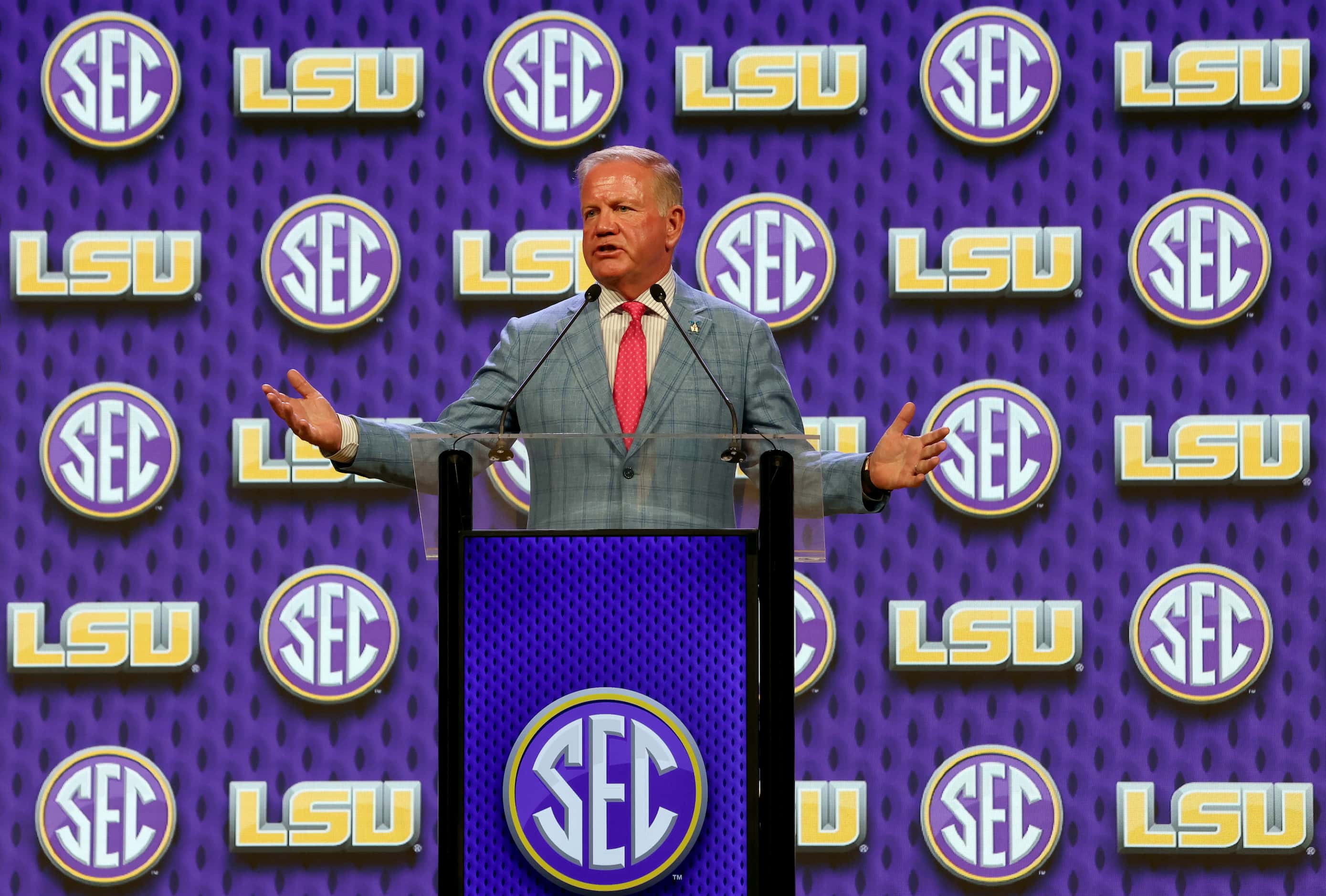 Brian Kelly, head coach of the LSU Tigers, answers a question from a media member following...