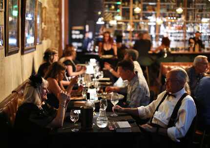 Customers enjoy the food, drinks and atmosphere at Speak in Rockwall in mid-June 2023.