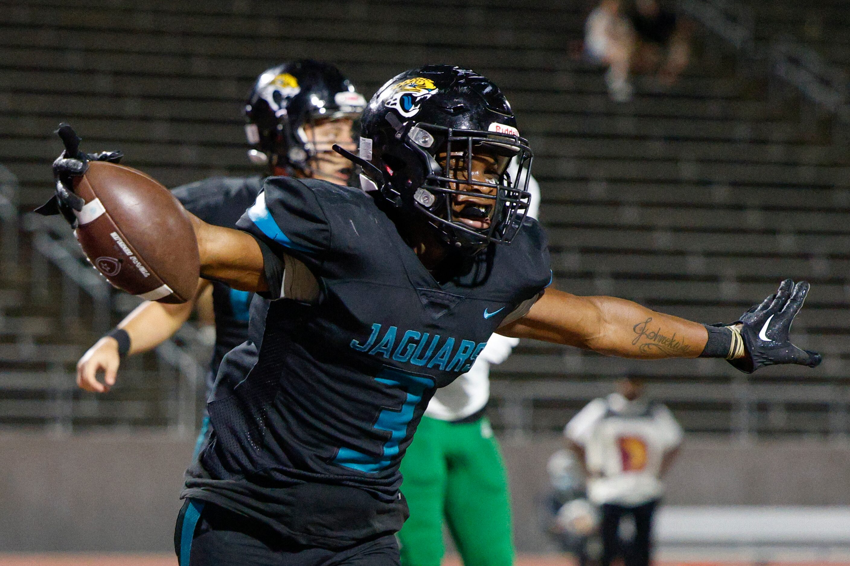 Molina running back Glen Jackson (3) celebrates a touchdown during the second half of a game...