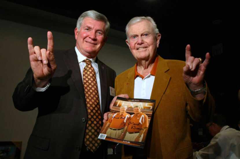 Texas football coach Mack Brown, left, with former coach Darrell Royal at a reception before...