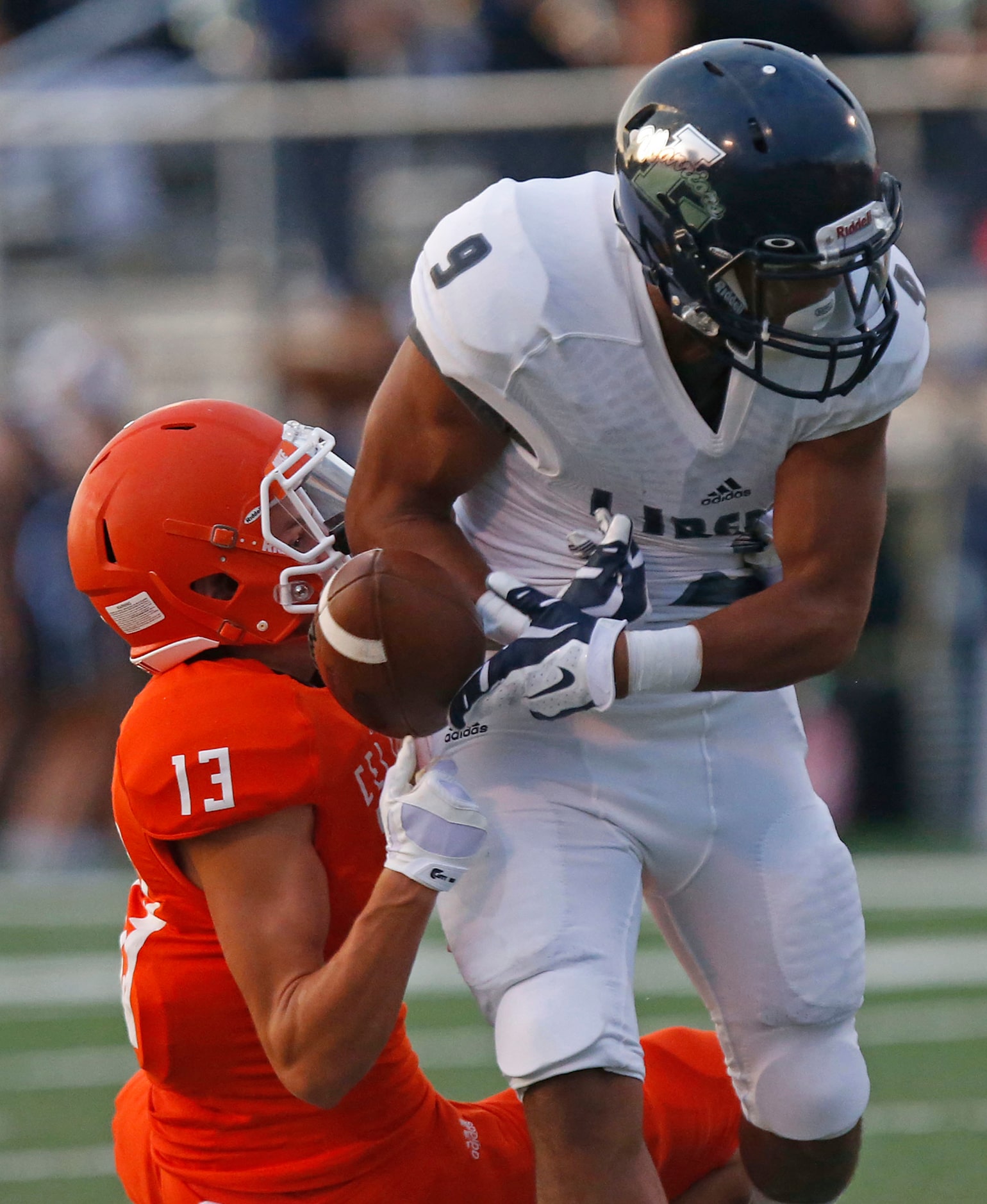 Celina High School defensive back Jeff Sims (13) got a hand on the football caught by...