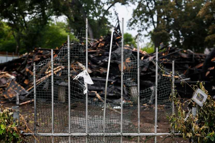 The remains of a historic home, which burned Sunday, is seen at 2426 Pine Street Wednesday...
