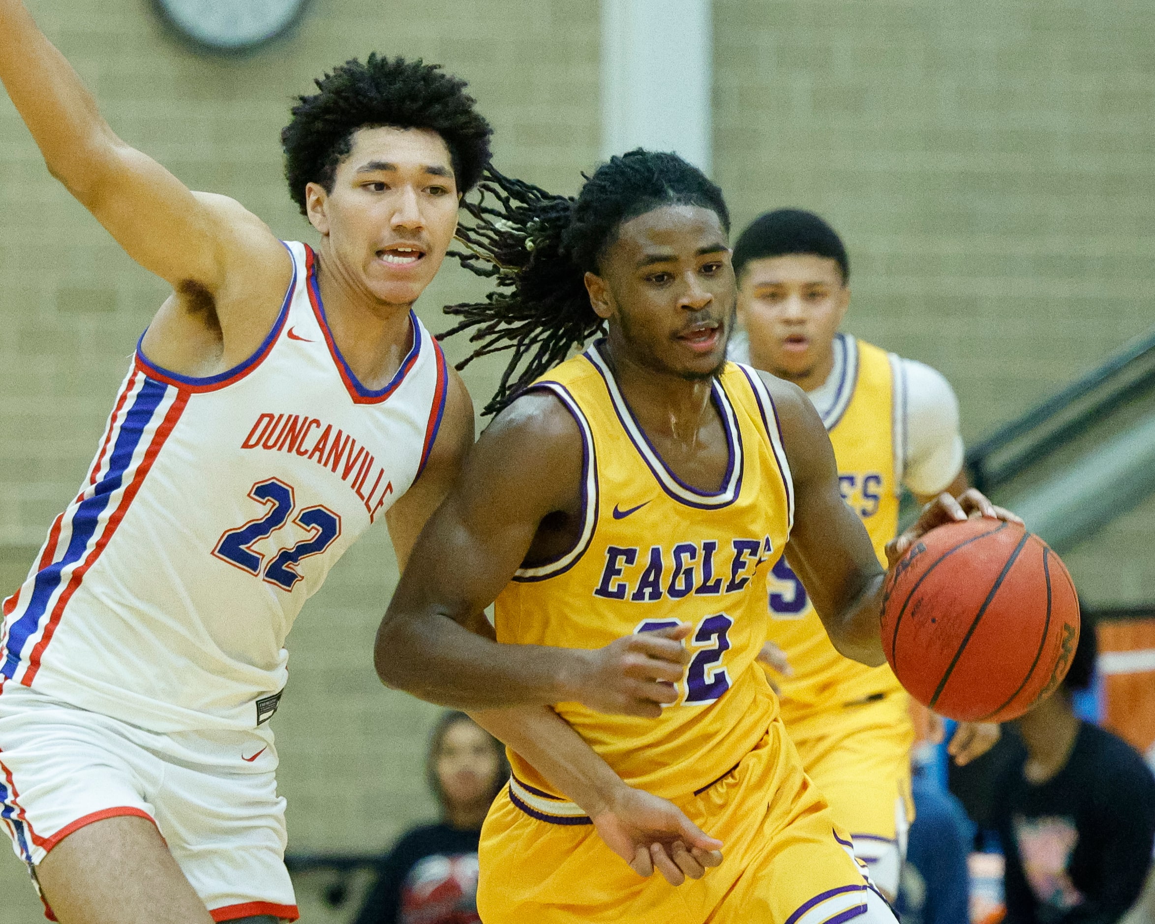 Richardson guard Cason Wallace (22) drives past Duncanville forward Davion Sykes (22) during...