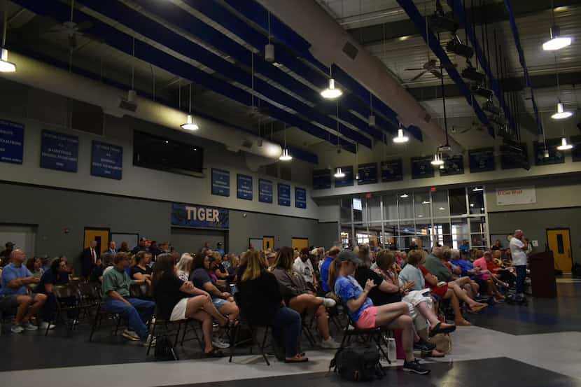 A crowd of Gunter residents listen in on Wednesday's city council meeting at Gunter High...