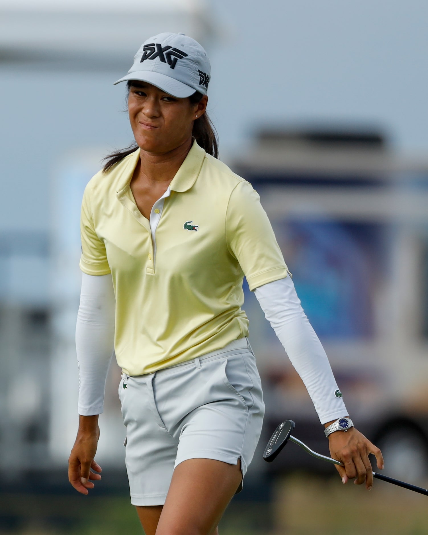 Professional golfer Celine Boutier reacts after missing a put on the 18th green during round...