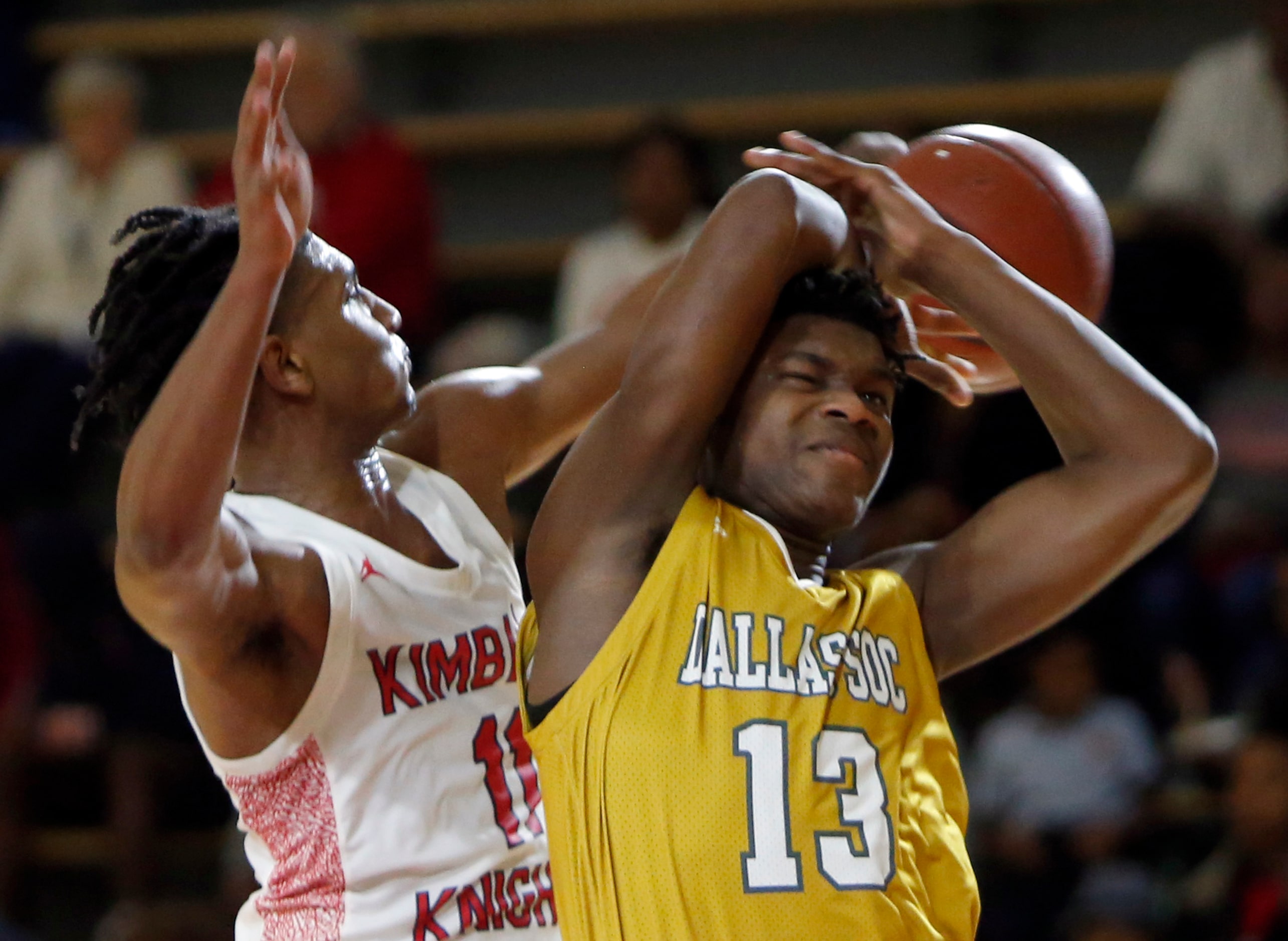 Dallas Kimball's Cory Reynolds (11) leaps to block a shot attempt by Dallas Oak Cliff's...