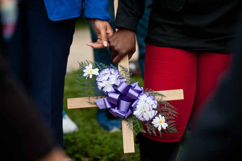 Brycelyn Beall, left, holds hands with Sheila Blankenship, mother of Da'Coreyan Blankenship,...