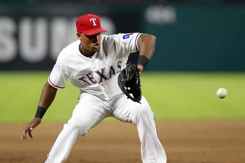 Texas Rangers third baseman Adrian Beltre (29) fields a ground ball hit by New York Yankees...