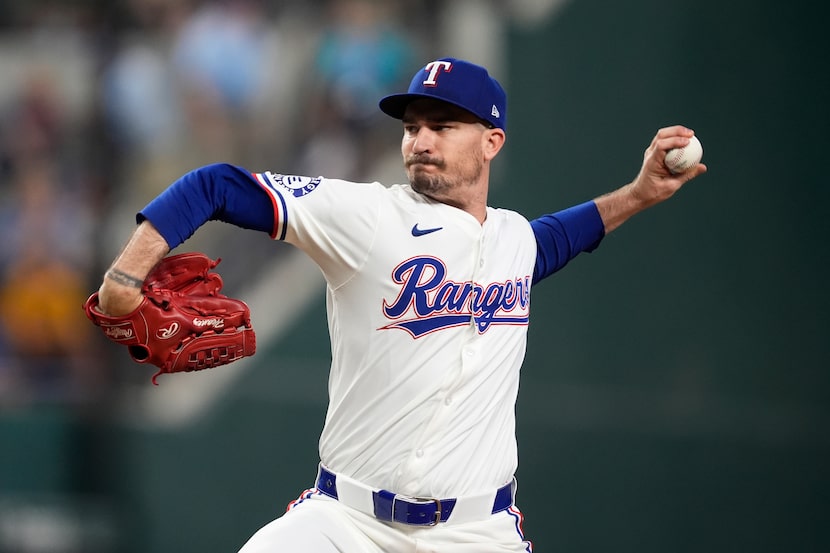 Texas Rangers starting pitcher Andrew Heaney throws to the Pittsburgh Pirates in the first...