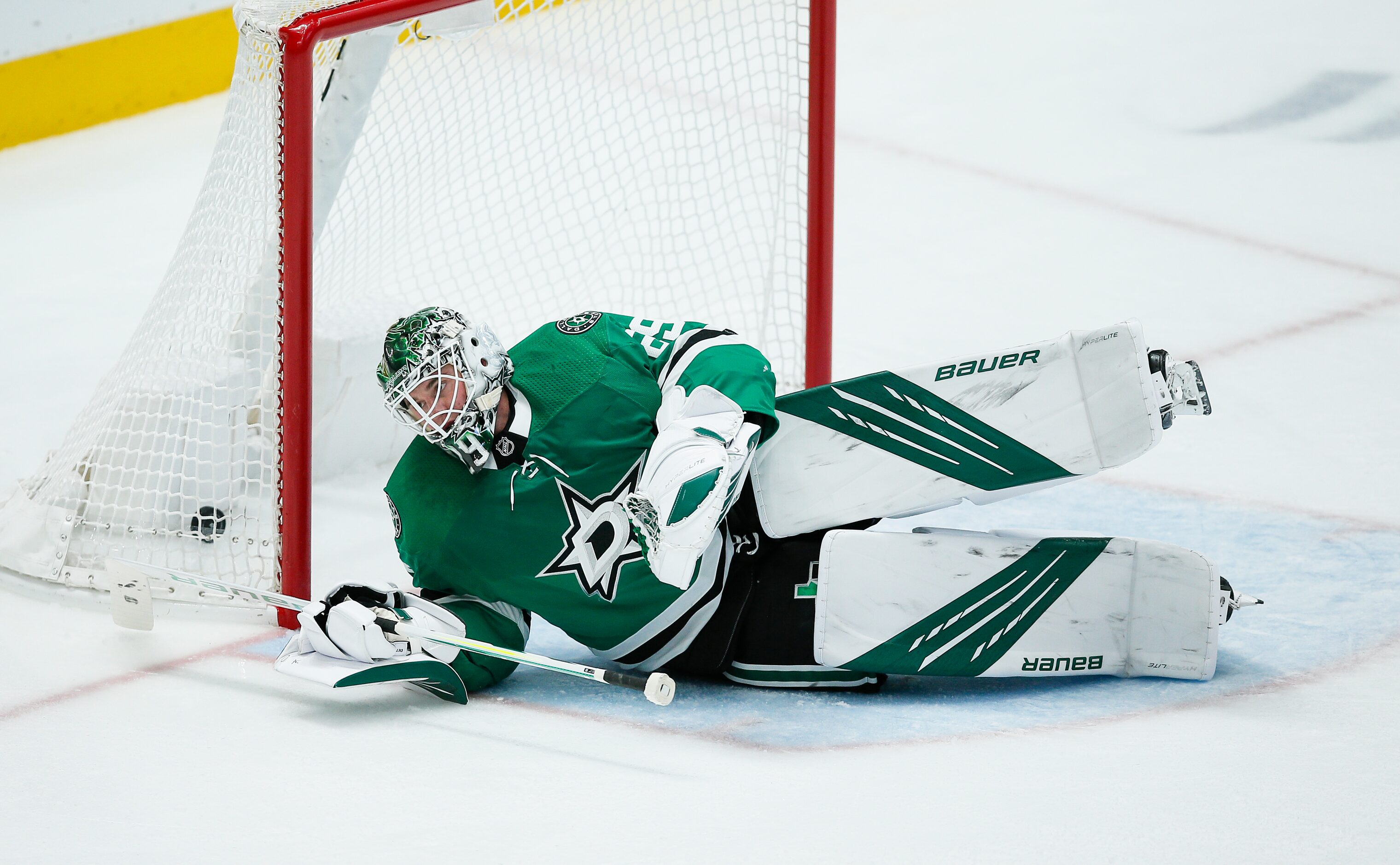 Dallas Stars goaltender Jake Oettinger (29) looks on after giving up a penalty shot goal to...