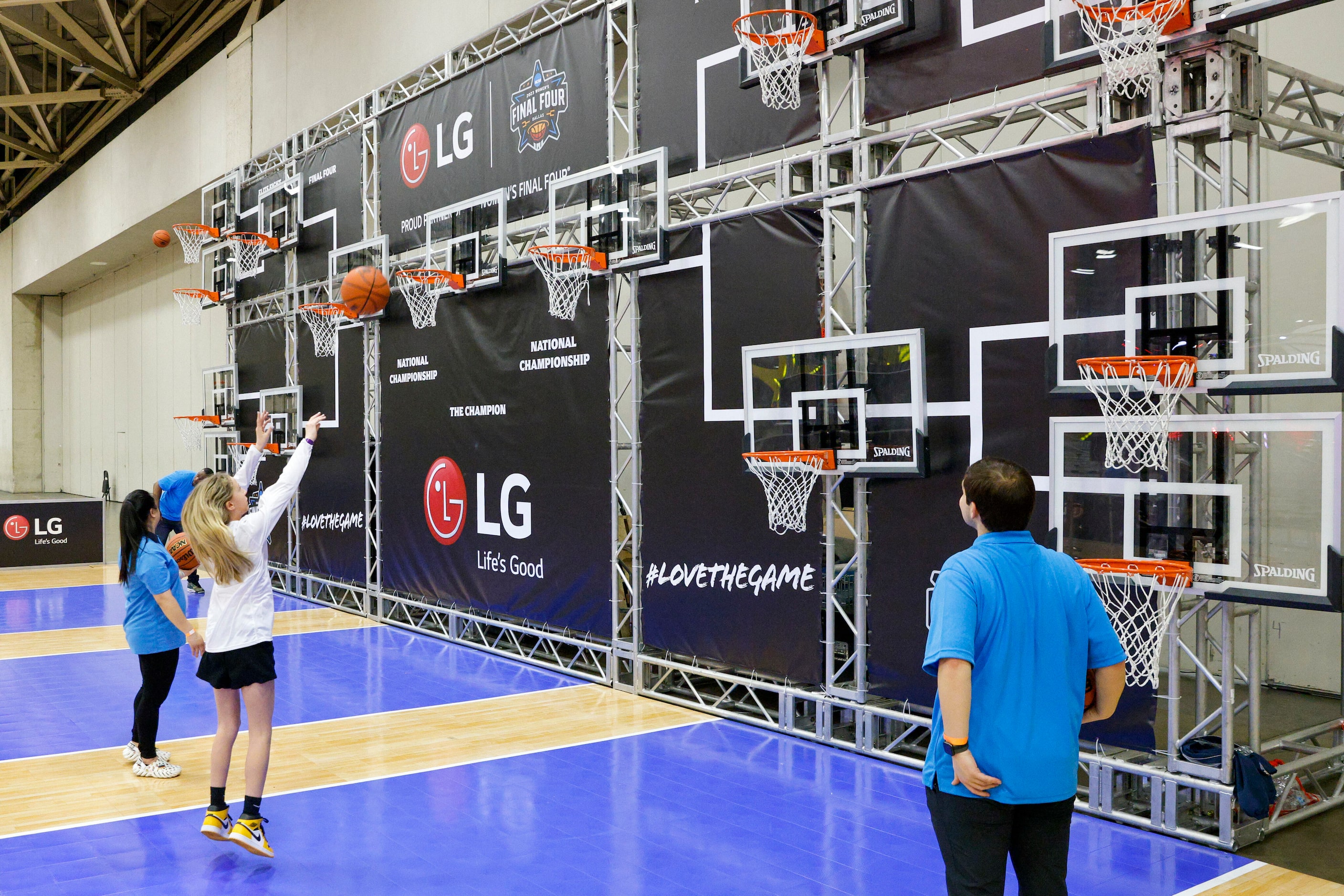 Sadie Lang, 12, of Illinois competes in a “Bracketball” shooting competition during the NCAA...