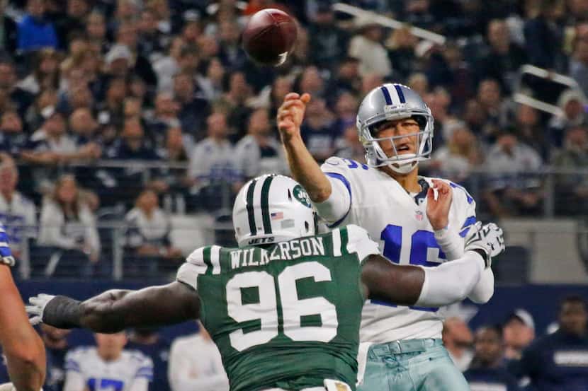 Dallas Cowboys quarterback Matt Cassel (16) gets a pass off under pressure from New York...