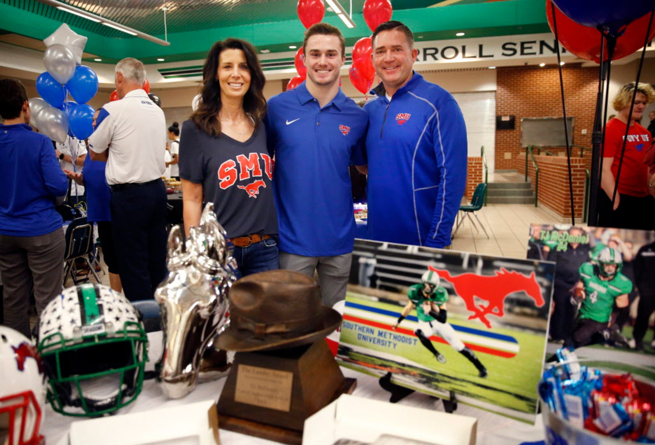 Southlake Carroll running back and Landry Award winner T.J. McDaniel (center) poses for a...