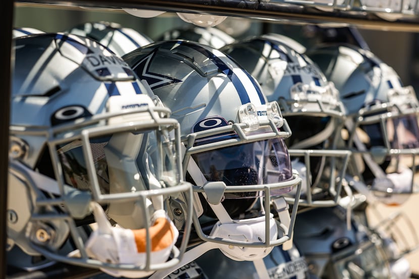 Dallas Cowboys helmets rest on a shelf after a Cowboys rookie minicamp at The Star in...