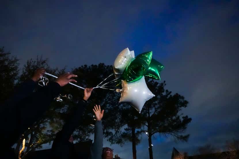 Balloons were released Tuesday in memory of Ja'Shawn Poirier outside New World United...