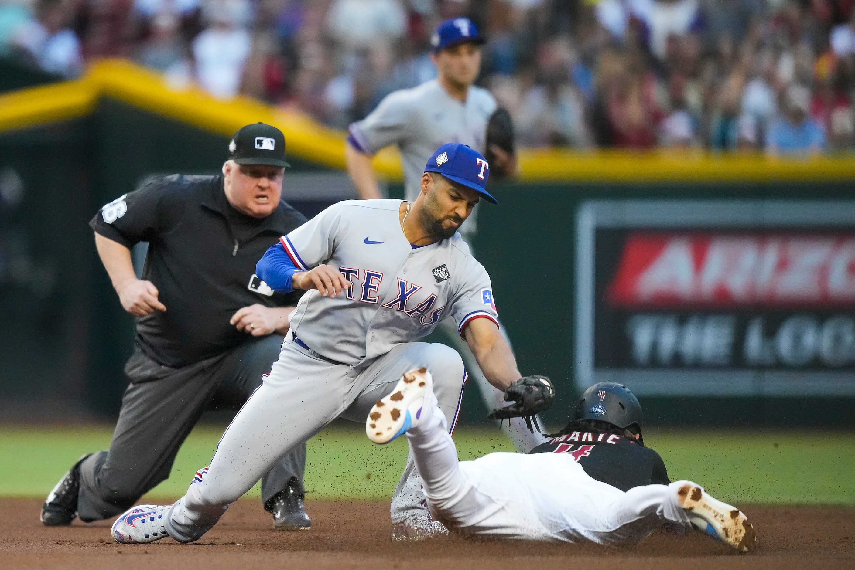 Arizona Diamondbacks second baseman Ketel Marte is caught stealing as Texas Rangers second...