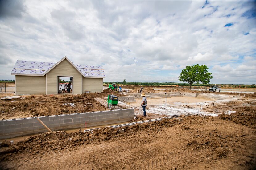 The first of two community swimming pools is  under construction at a new Hillwood...