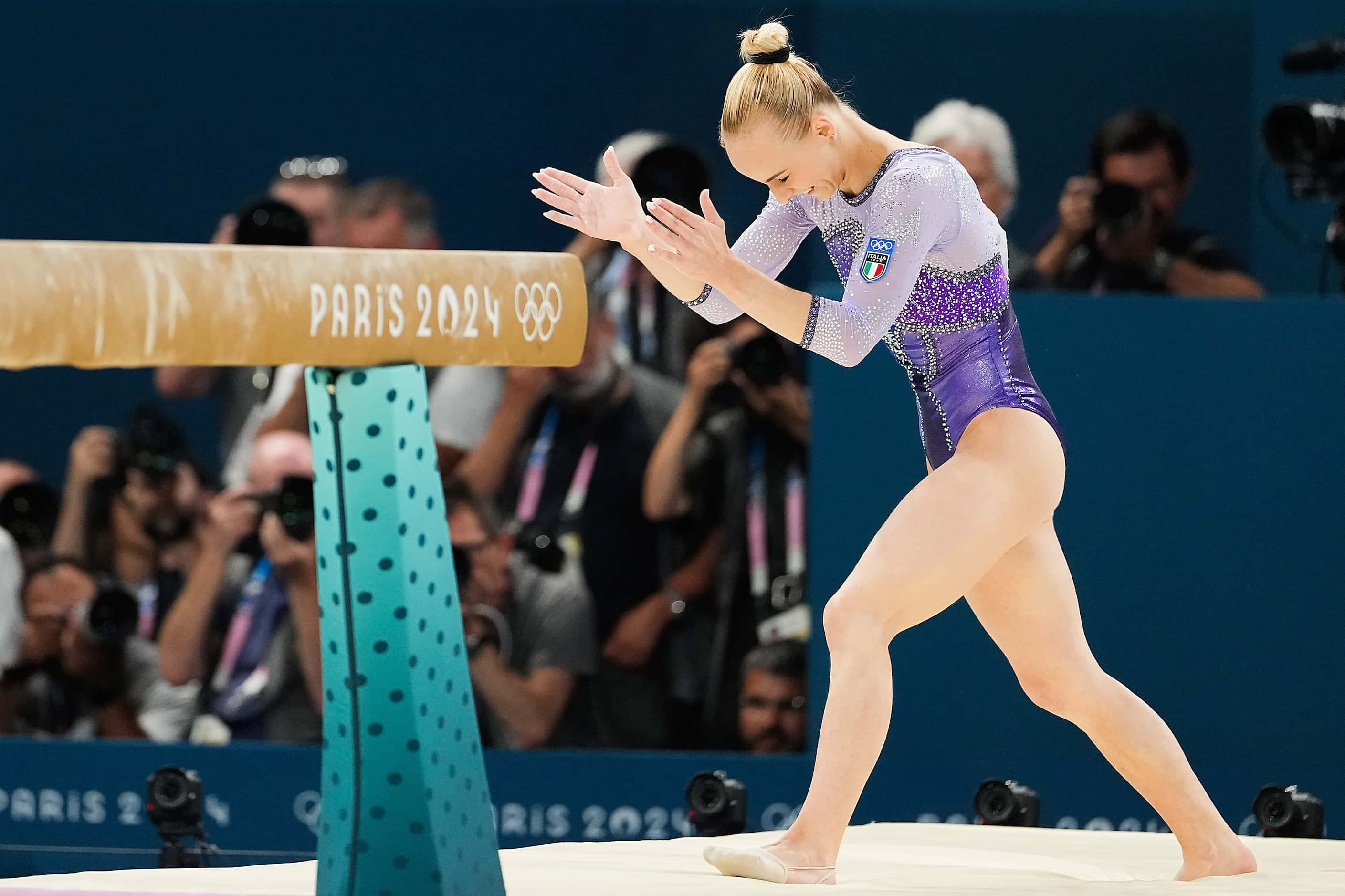 Gold medalist Alice D’Amato of Italy celebrates after her performance on the balance beam...