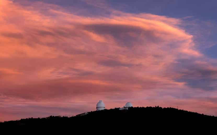 The Harlan J. Smith Telescope (left) and Otto Struve Telescope are seen at sunset atop Mount...