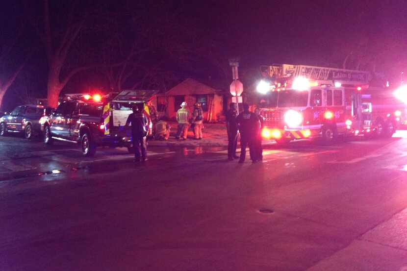Dallas Fire-Rescue crews were battling a house fire Sunday near the site of a house...
