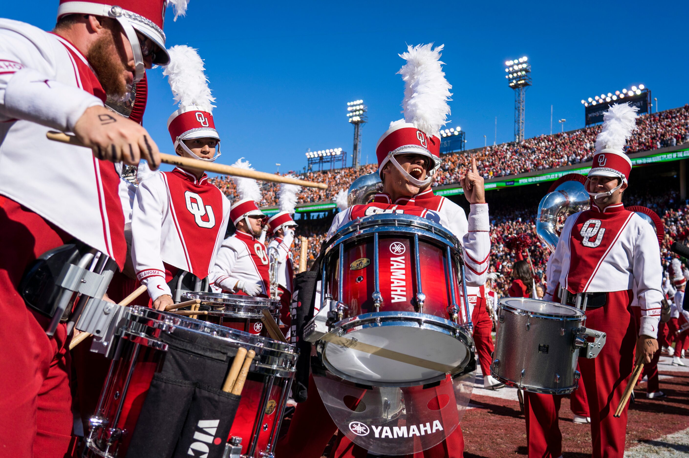 Oklahoma band members get pumped up before an NCAA football game against Texas at the Cotton...