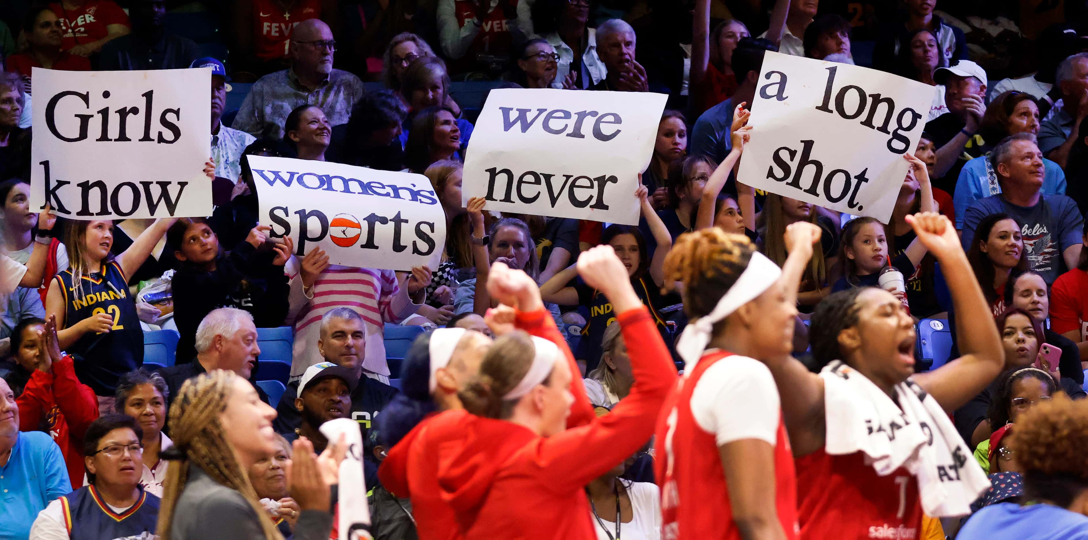 Fans show their support for women’s athletics during a second half timeout in the Indiana...