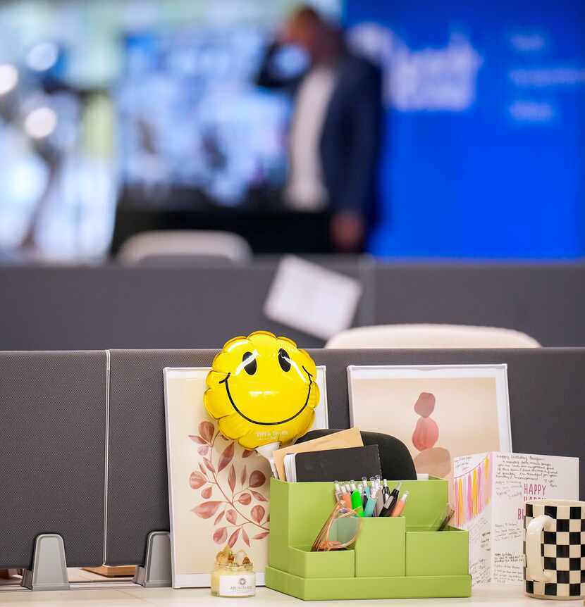 A smiley face balloon sits on a desk while CEO and co-founder Matt Tresidder addresses a...