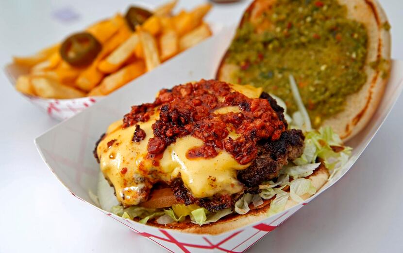 
A Diablo Burger with cheese fries is made by NVN Burgers, one of the food trucks at the...