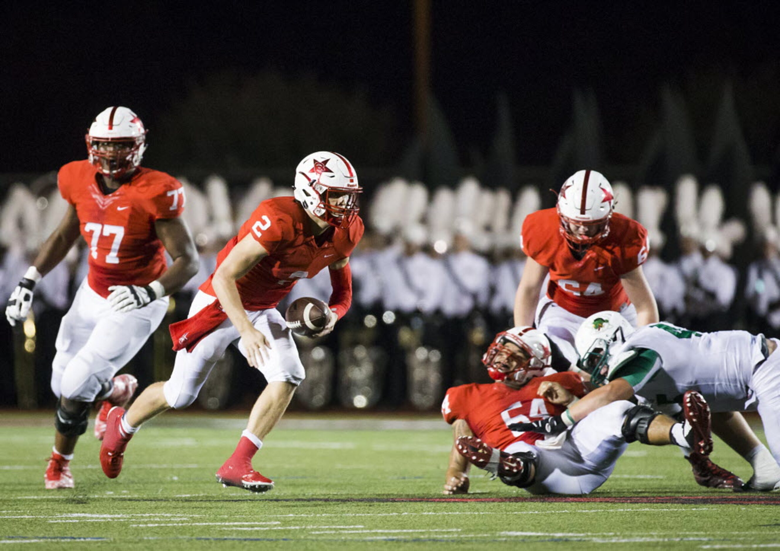 Coppell quarterback Brady Mcbride (2) runs for a first down during the second quarter of a...