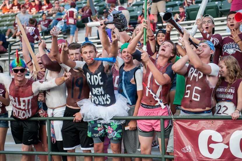 Rowlett High School students cheer on the football team during a 36-27 loss to North...