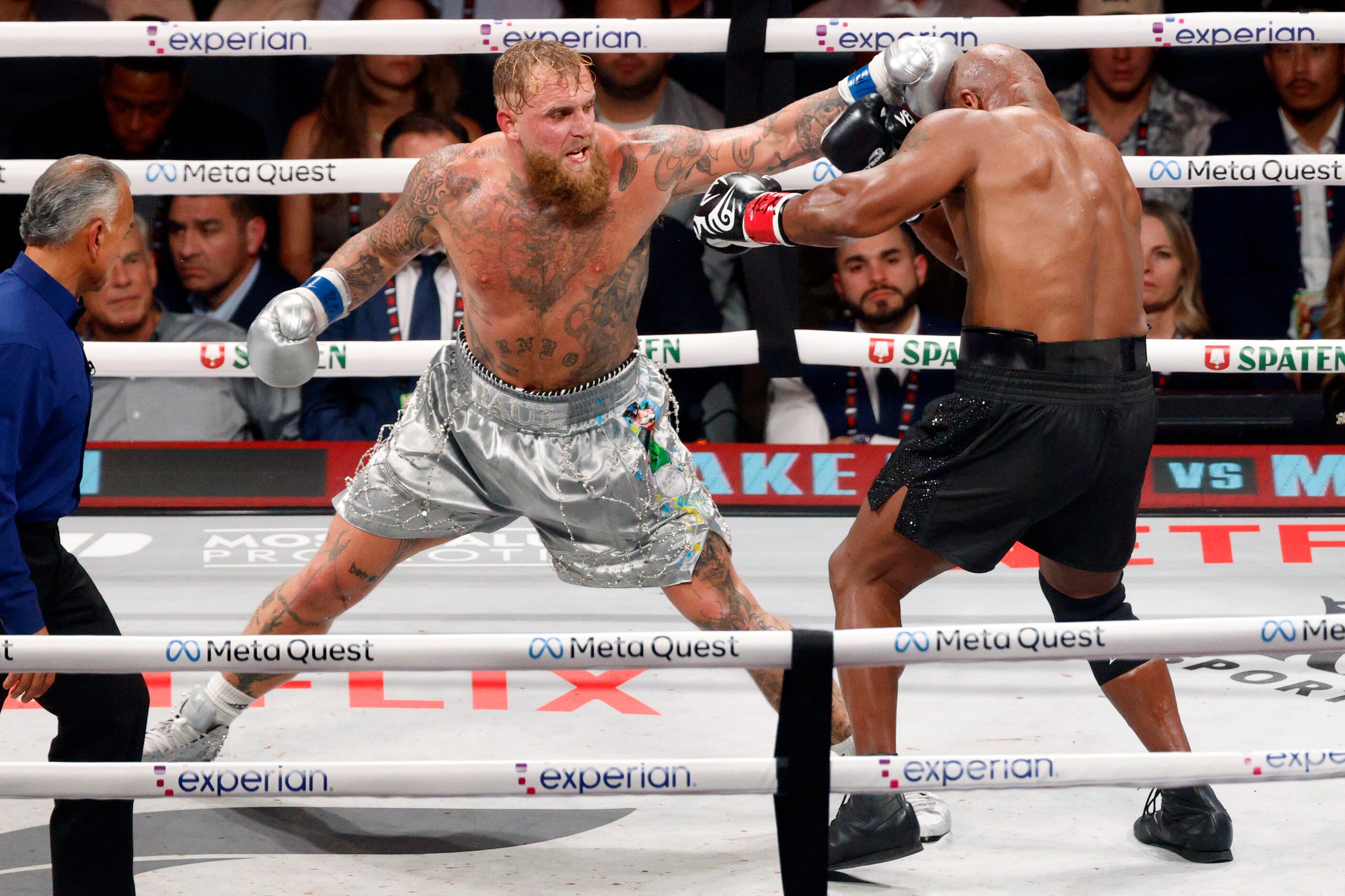 Jake Paul lands a punch on Mike Tyson during round six of a heavyweight boxing match,...