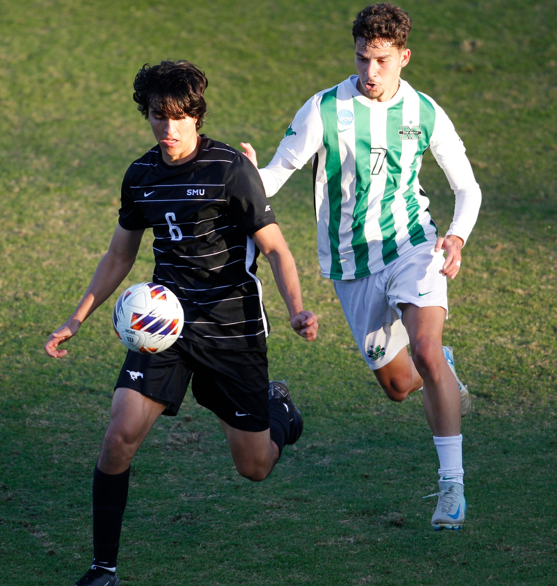 SMU Mustangs midfielder Alex Salvo (6), left, and Marshall forward Kyran Chambron Pinho (7)...