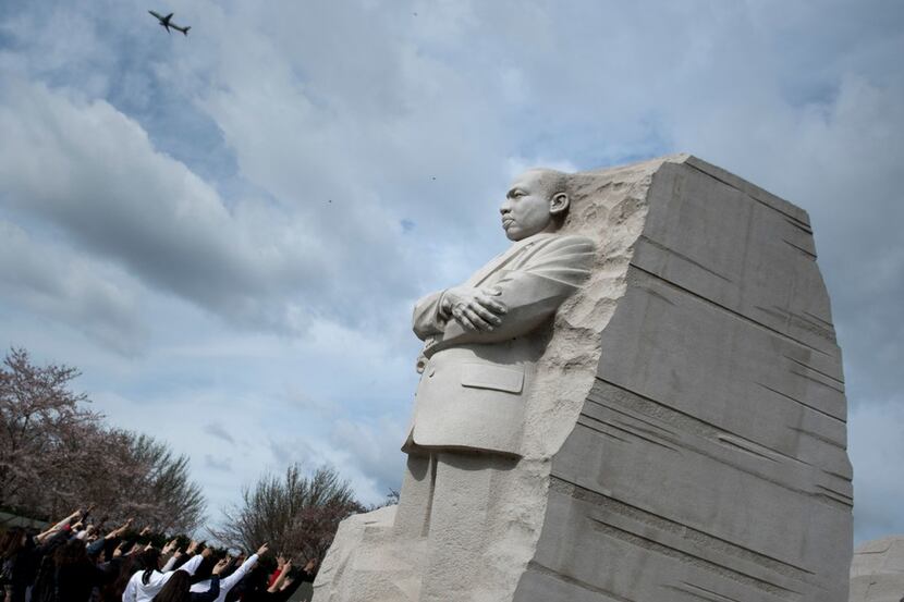 People point to the Martin Luther King Jr. Memorial on the National Mall in Washington, D.C....
