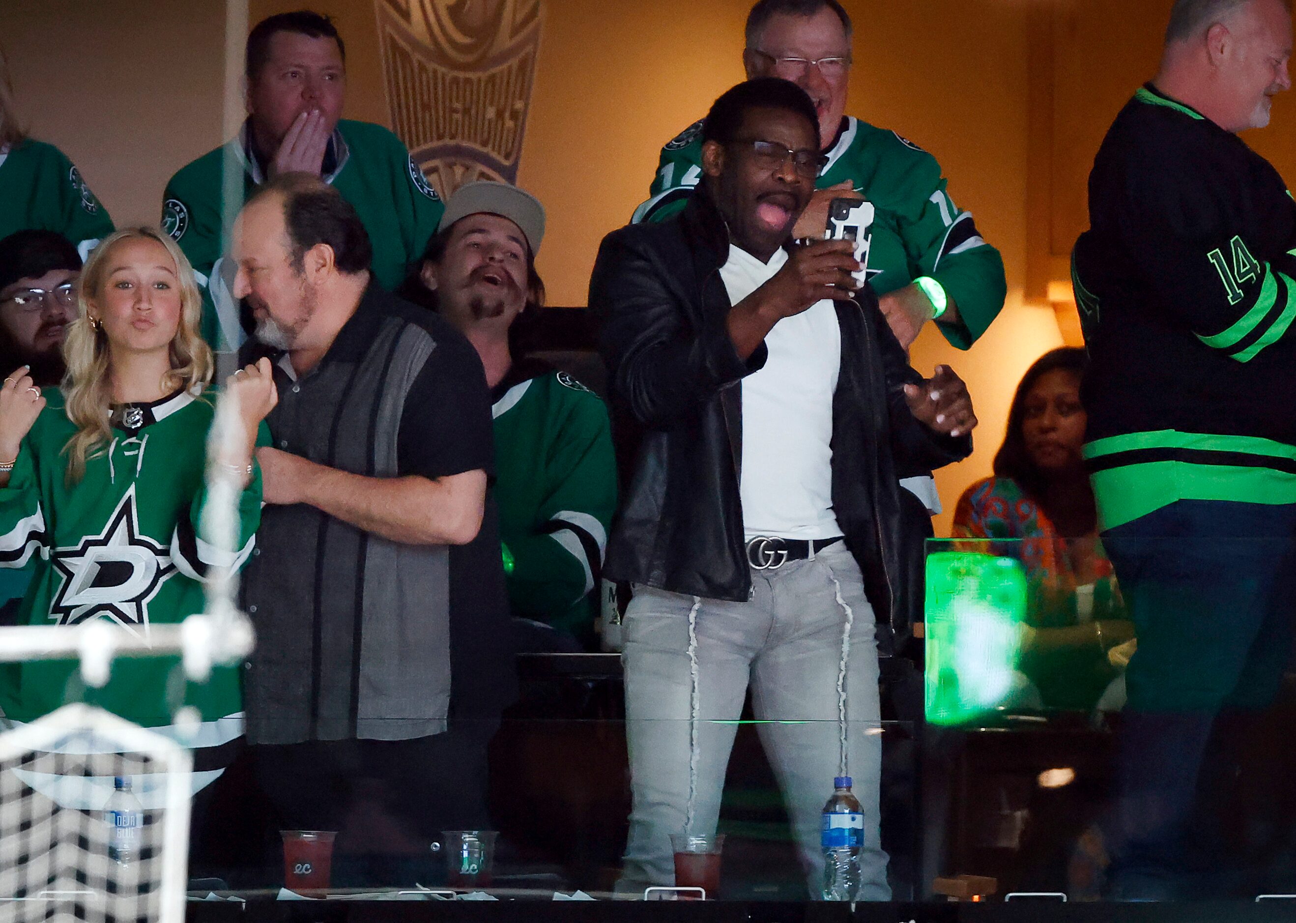 Dallas Cowboys Hall of Fame receiver Michael Irvin (second from right) cheers Dallas Stars...