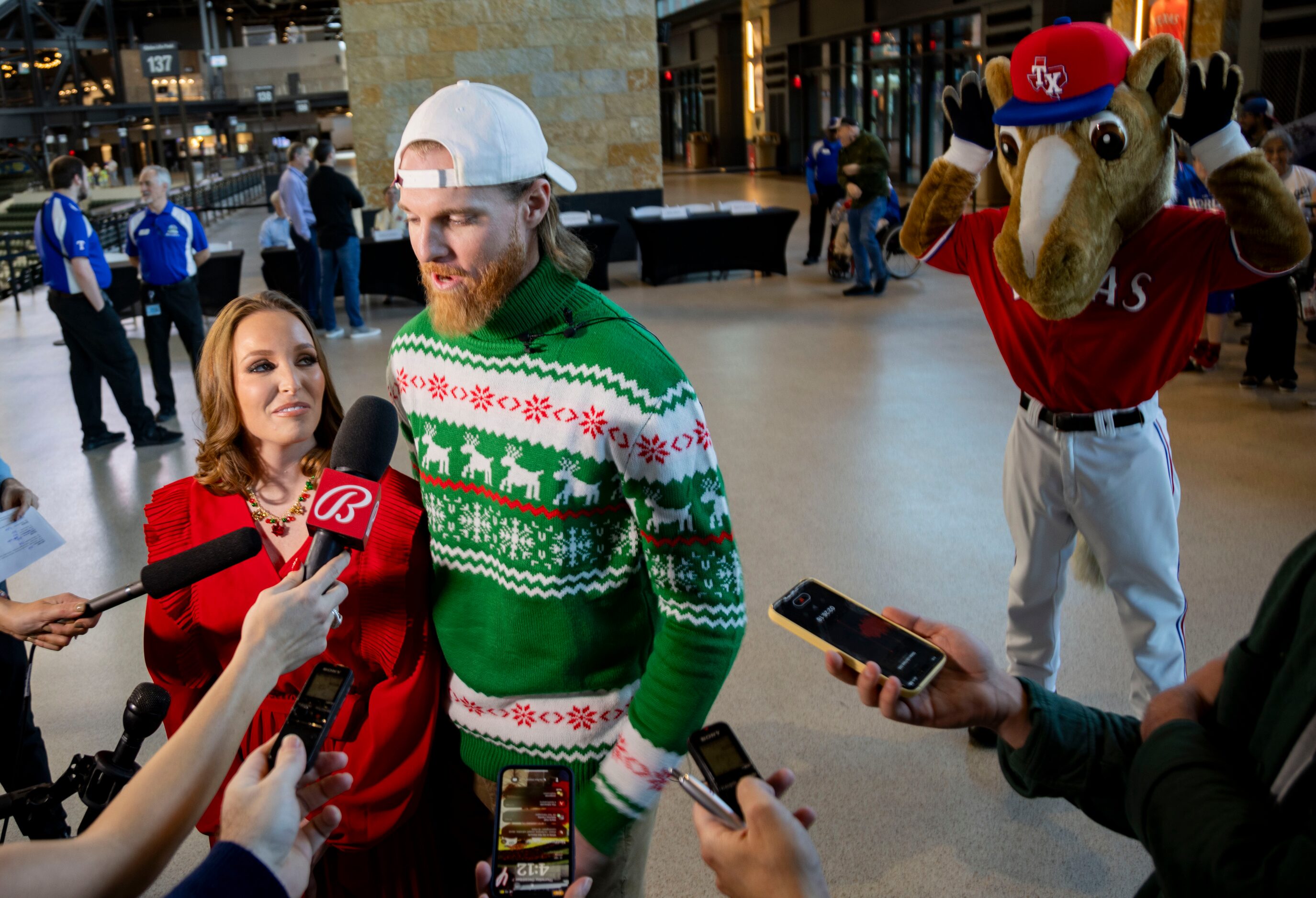 Rangers pitcher Jon Gray and his wife, Jackyln, talk to the press as Rangers Captain teases...