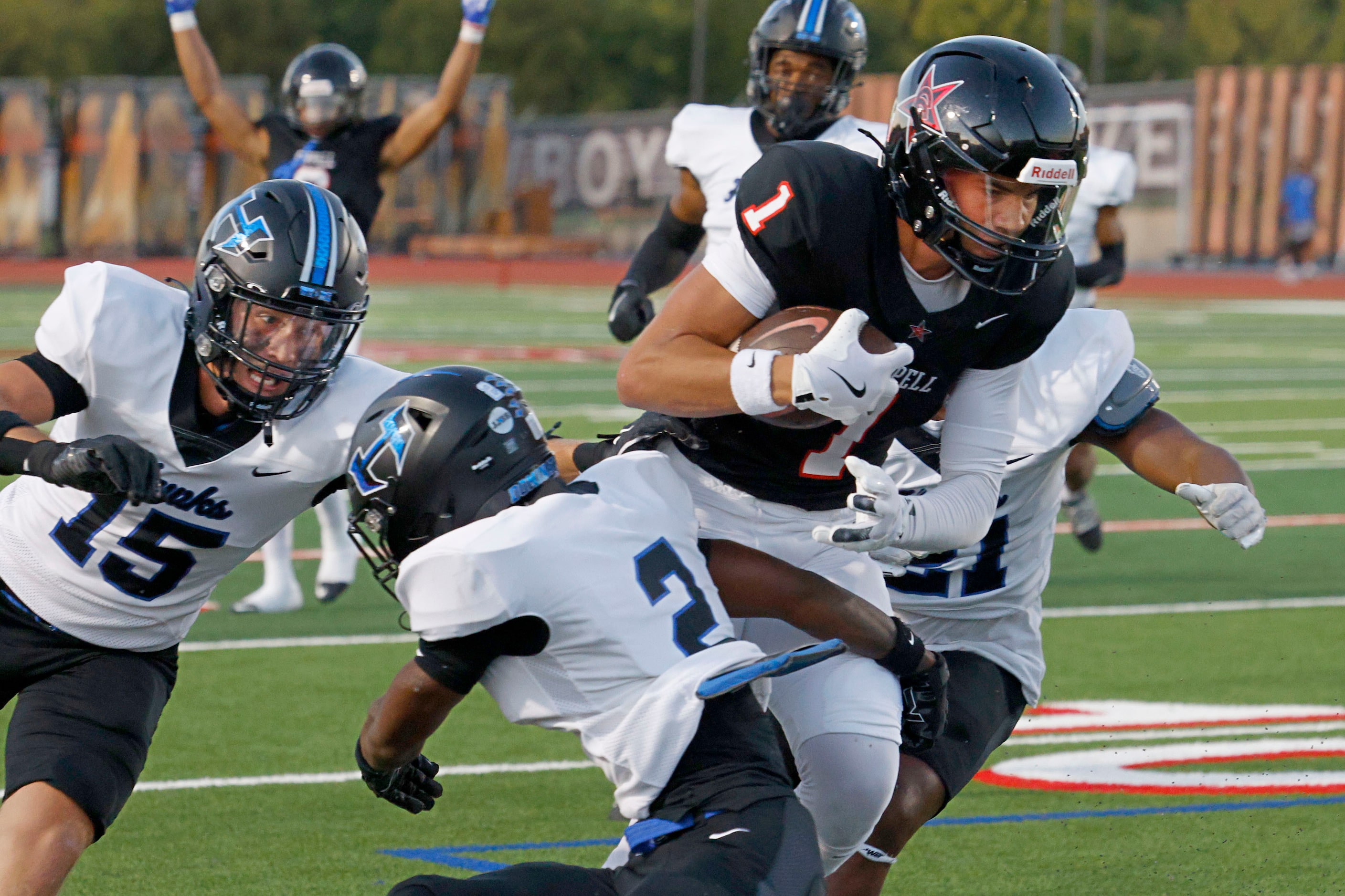 Coppell's Tucker Cusano (1) runs for a touchdown as Hebron's Jeylin Cook (2), Hebron's Aaron...