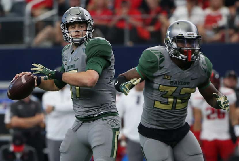 Baylor Bears quarterback Seth Russell (17) attempts to throw the ball in the first half...